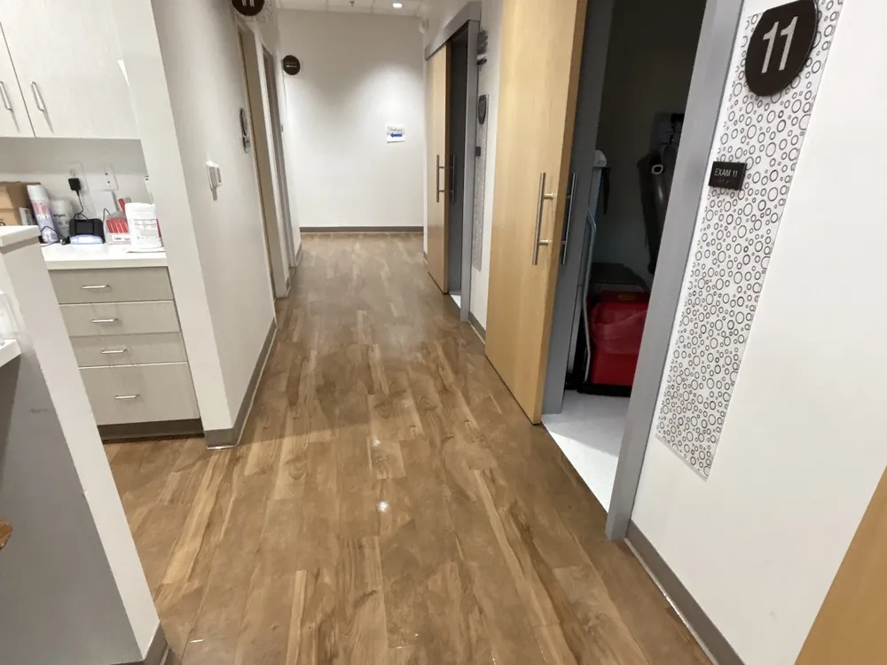 Clean, shining hallway outside medical exam rooms