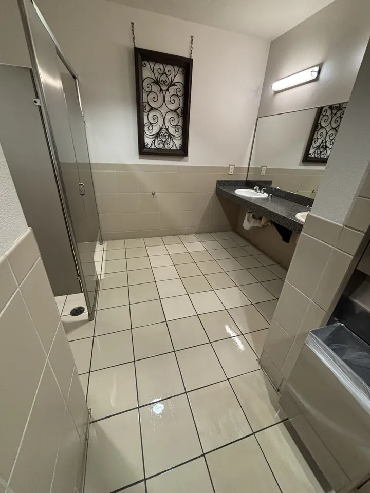 Spotless restroom with shining tile floor