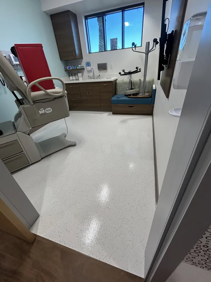 Bright, spotless exam room with a polished floor