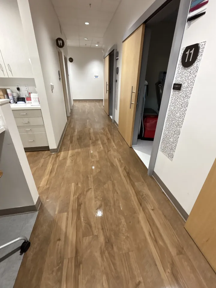 Clean medical office hallway outside exam rooms